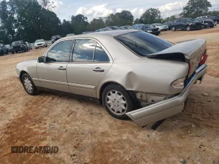 1999 Mercedes-Benz E-Class with VIN WDBJF65HXXA891437, listed as a Copart auction lot 73278334 with 197,159 mi miles and Salvage Title. Bid and sale history available at carsss.com. Image 2.