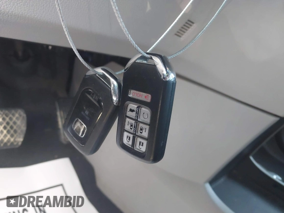 2018 Honda Odyssey EX-L with VIN 5FNRL6H75JB092633, listed as a IAAI auction lot 41971589 with 103,099 mi miles and . Bid and sale history available at DreamBid. Image 11.