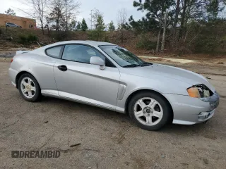2003 Hyundai Tiburon GT z VIN KMHHN65F13U013420, wystawiony jako Copart lot #51234495 z przebiegiem 230 612 mil mil oraz Szkoda całkowita • Salvage title. Historia ofert i sprzedaży dostępna na DreamBid. Obrazek 4.