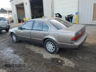 1990 Nissan Maxima z VIN JN1HJ01P3LT393901, wystawiony jako Copart lot #79912694 z przebiegiem 127 678 mil mil oraz Szkody całkowita. Historia ofert i sprzedaży dostępna na DreamBid. Obrazek 2.