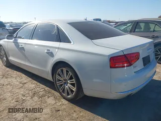 2014 Audi A8 3.0T z VIN WAURGAFDXEN006902, wystawiony jako IAAI lot #41099662 z przebiegiem 118 734 mil mil oraz . Historia ofert i sprzedaży dostępna na DreamBid. Obrazek 3.