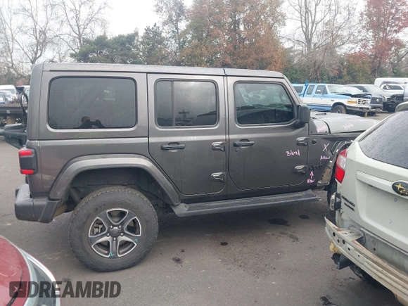 2021 Jeep Wrangler Unlimited Sahara z VIN 1C4JJXP68MW745098, wystawiony jako IAAI lot #41461092 z przebiegiem 36 410 mil mil oraz . Historia ofert i sprzedaży dostępna na DreamBid. Obrazek 14.