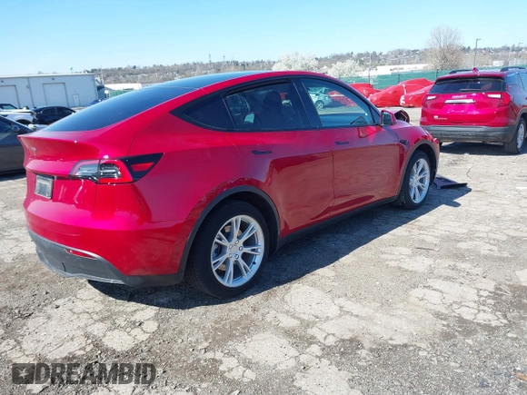 2021 Tesla Model Y Standard Range with VIN 5YJYGDED1MF111410, listed as a IAAI auction lot 41942323 with 24,836 mi miles. Bid and sale history available at carsss.com. Image 4.