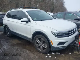 2019 Volkswagen Tiguan SEL Premium with VIN 3VV4B7AX7KM123859, listed as a IAAI auction lot 41555664 with 77,384 mi miles and . Bid and sale history available at DreamBid. Image 1.