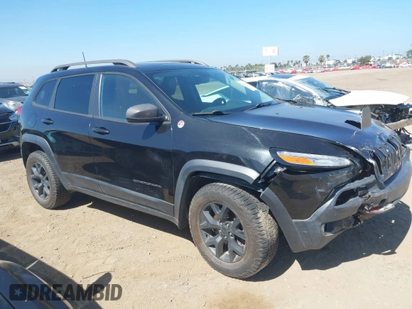2016 Jeep Cherokee Trailhawk with VIN 1C4PJMBB9GW179051, listed as a IAAI auction lot 42520342 with 100,538 mi miles and . Bid and sale history available at DreamBid. Image 1.