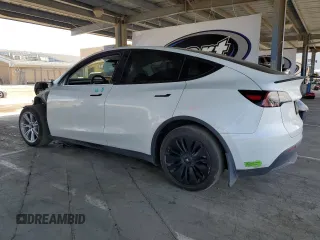 2023 Tesla Model Y Long Range with VIN 7SAYGDEE8PF620703, listed as a Copart auction lot 54655105 with 29,538 mi miles and Salvage Title. Bid and sale history available at DreamBid. Image 2.