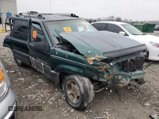 1997 Jeep Grand Cherokee Laredo with VIN 1J4GZ58S5VC720174, listed as a Copart auction lot 44169635 with Not provided miles and Salvage title. Bid and sale history available at DreamBid. Image 4.