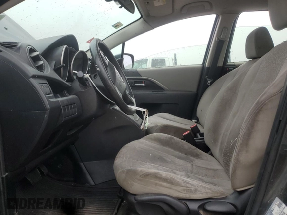 2012 Mazda 5 Sport with VIN JM1CW2BL3C0121849, listed as a Copart auction lot 61789675 with 144,379 mi miles and Salvage title. Bid and sale history available at DreamBid. Image 7.