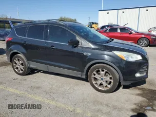 2013 Ford Escape SE with VIN 1FMCU0GX8DUA38056, listed as a Copart auction lot 57617885 with 128,467 mi miles and Salvage title. Bid and sale history available at DreamBid. Image 4.