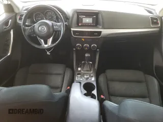 2016 Mazda CX-5 Touring z VIN JM3KE2CY4G0805072, wystawiony jako Copart lot #58435535 z przebiegiem 146 323 mil mil oraz Szkoda całkowita • Salvage title. Historia ofert i sprzedaży dostępna na DreamBid. Obrazek 8.