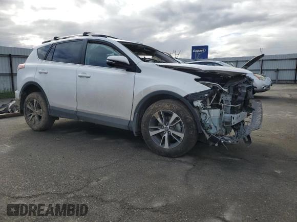 2018 Toyota RAV4 XLE with VIN 2T3WFREV1JW471752, listed as a Copart auction lot 46952565 with 87,705 mi miles and Salvage Title. Bid and sale history available at DreamBid. Image 4.