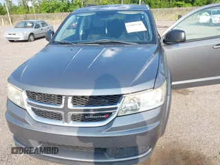 2013 Dodge Journey SE z VIN 3C4PDCAB5DT518019, wystawiony jako IAAI lot #42409340 z przebiegiem 174 339 mil mil oraz . Historia ofert i sprzedaży dostępna na DreamBid. Obrazek 6.