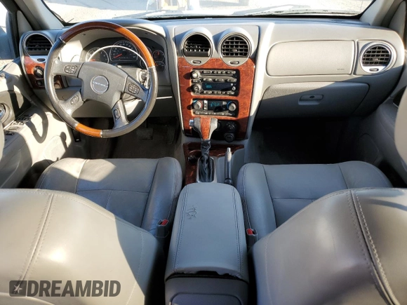 2006 GMC Envoy Denali z VIN 1GKES66M766163803, wystawiony jako Copart lot #75289784 z przebiegiem 194 386 mil mil oraz Szkoda całkowita • Salvage title. Historia ofert i sprzedaży dostępna na DreamBid. Obrazek 8.