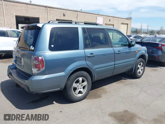 2007 Honda Pilot EX with VIN 2HKYF18447H520522, listed as a IAAI auction lot 42018937 with 128,401 mi miles. Bid and sale history available at carsss.com. Image 4.