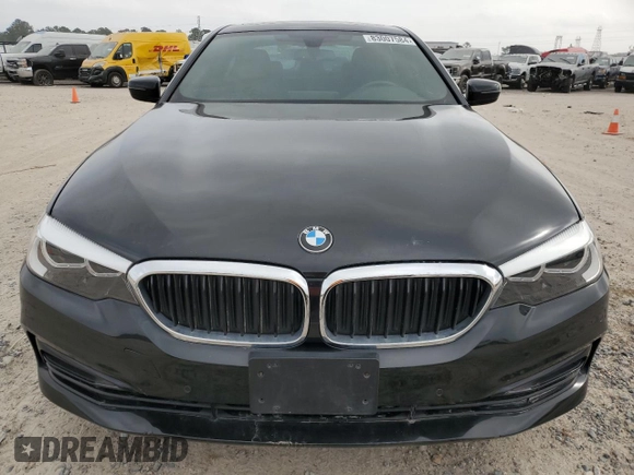2018 BMW 5 Series 530i with VIN WBAJA5C54JG899845, listed as a Copart auction lot 83007584 with 57,379 mi miles and Salvage Title. Bid and sale history available at DreamBid. Image 5.