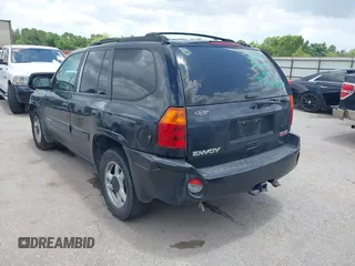 2005 GMC Envoy SLE with VIN 1GKDS13SX52373187, listed as a IAAI auction lot 42434190 with 112,965 mi miles and . Bid and sale history available at DreamBid. Image 3.