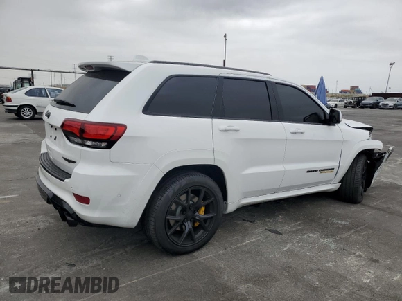 2018 Jeep Grand Cherokee Trackhawk with VIN 1C4RJFN91JC293695, listed as a Copart auction lot 59031525 with 8,565 mi miles and Salvage title. Bid and sale history available at DreamBid. Image 3.