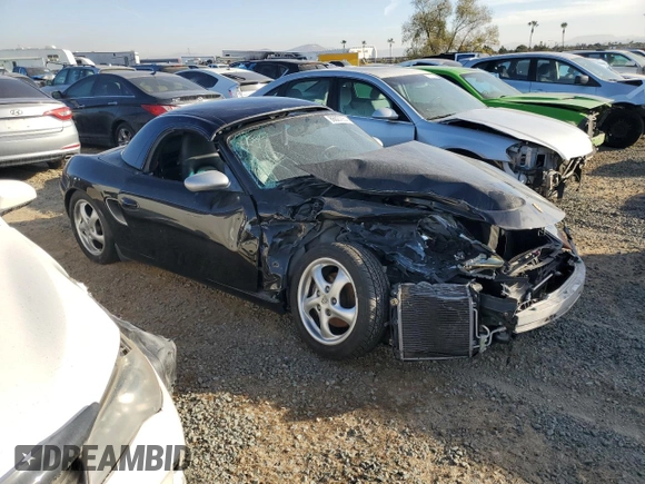 2000 Porsche Boxster z VIN WP0CA2984YU627674, wystawiony jako Copart lot #86027054 z przebiegiem 112 153 mil mil oraz Szkoda całkowita • Salvage title. Historia ofert i sprzedaży dostępna na DreamBid. Obrazek 4.