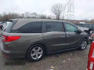 2018 Honda Odyssey EX-L with VIN 5FNRL6H72JB081086, listed as a IAAI auction lot 41031370 with 73,907 mi miles and . Bid and sale history available at DreamBid. Image 13.