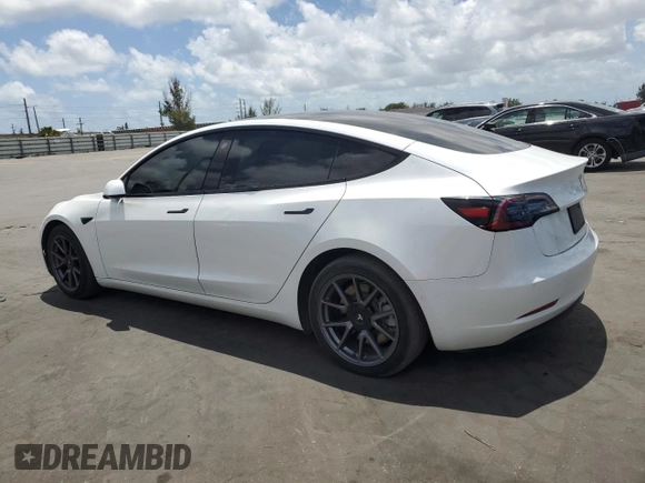 2021 Tesla Model 3 Standard Range Plus with VIN 5YJ3E1EA2MF985463, listed as a Copart auction lot 53311455 with 23,176 mi miles and Clean Title. Bid and sale history available at DreamBid. Image 2.