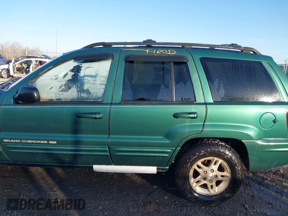 1999 Jeep Grand Cherokee Limited with VIN 1J4GW68S1XC555399, listed as a IAAI auction lot 41764099 with 1 mi miles. Bid and sale history available at carsss.com. Image 6.