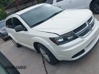2013 Dodge Journey SE z VIN 3C4PDCAB0DT728673, wystawiony jako IAAI lot #42354849 z przebiegiem 147 226 mil mil oraz . Historia ofert i sprzedaży dostępna na DreamBid. Obrazek 1.