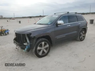 2015 Jeep Grand Cherokee Overland with VIN 1C4RJFCG6FC848097, listed as a Copart auction lot 47168705 with 102,758 mi miles and Salvage title. Bid and sale history available at DreamBid. Image 1.