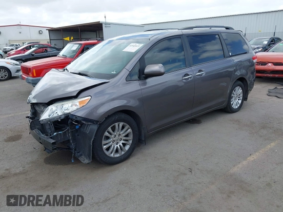 2014 Toyota Sienna XLE with VIN 5TDYK3DC7ES517206, listed as a IAAI auction lot 41945572 with 128,743 mi miles and . Bid and sale history available at DreamBid. Image 2.