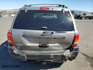 1999 Jeep Grand Cherokee Laredo with VIN 1J4GW58N4XC739465, listed as a Copart auction lot 76130544 with 195,649 mi miles and Salvage Title. Bid and sale history available at carsss.com. Image 6.