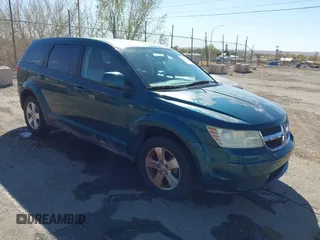 2009 Dodge Journey SXT with VIN 3D4GG57V09T170094, listed as a IAAI auction lot 41867577 with 122,831 mi miles. Bid and sale history available at carsss.com. Image 1.