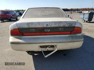1994 Infiniti Q45 z VIN JNKNG01D3RM252218, wystawiony jako Copart lot #77230944 z przebiegiem 69 069 mil mil oraz Tytuł czysty. Historia ofert i sprzedaży dostępna na DreamBid. Obrazek 6.