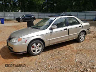 2002 Mazda Protege DX z VIN JM1BJ225420552730, wystawiony jako Copart lot #56366585 z przebiegiem 130 335 mil mil oraz Szkoda całkowita • Salvage title. Historia ofert i sprzedaży dostępna na DreamBid. Obrazek 1.