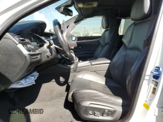 2014 BMW M5 with VIN WBSFV9C57ED097570, listed as a Copart auction lot 88571785 with 100,391 mi miles and Salvage Title. Bid and sale history available at carsss.com. Image 7.