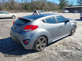 2015 Hyundai Veloster Turbo with VIN KMHTC6AE8FU229198, listed as a IAAI auction lot 41596345 with 74,943 mi miles. Bid and sale history available at carsss.com. Image 4.