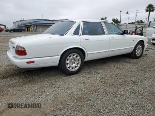 1999 Jaguar XJ with VIN SAJHX1040XC864208, listed as a Copart auction lot 59748585 with 130,577 mi miles and Clean title. Bid and sale history available at DreamBid. Image 3.
