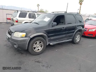 2006 Ford Escape XLT with VIN 1FMYU03156KA42961, listed as a IAAI auction lot 41820423 with 168,212 mi miles. Bid and sale history available at carsss.com. Image 2.