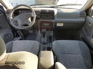 2002 Isuzu Rodeo S with VIN 4S2CK58W124307433, listed as a Copart auction lot 75447074 with 129,163 mi miles and Salvage title. Bid and sale history available at DreamBid. Image 8.