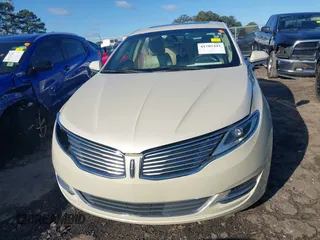 2016 Lincoln MKZ z VIN 3LN6L2G9XGR605070, wystawiony jako IAAI lot #41705442 z przebiegiem 136 565 mil mil oraz . Historia ofert i sprzedaży dostępna na DreamBid. Obrazek 13.
