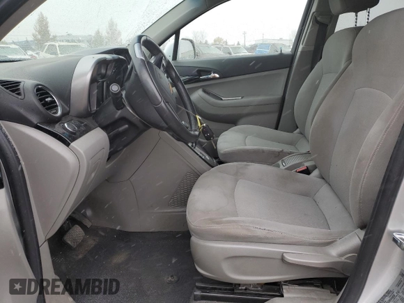 2012 Chevrolet Orlando 1LT z VIN KL77P2EM1CK550055, wystawiony jako Copart lot #77021754 z przebiegiem 127 987 mil mil oraz Szkoda całkowita • Salvage title. Historia ofert i sprzedaży dostępna na DreamBid. Obrazek 7.