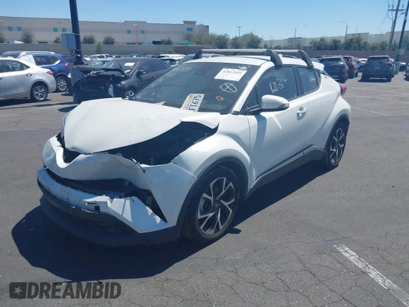 2019 Toyota C-HR XLE with VIN JTNKHMBX4K1040772, listed as a IAAI auction lot 41812031 with 79,729 mi miles. Bid and sale history available at carsss.com. Image 2.