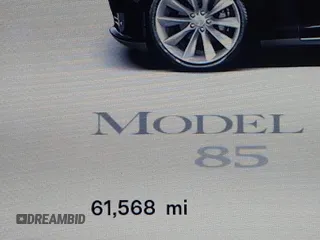 2013 Tesla Model S with VIN 5YJSA1CN0DFP20053, listed as a IAAI auction lot 41470660 with 61,568 mi miles and . Bid and sale history available at DreamBid. Image 7.