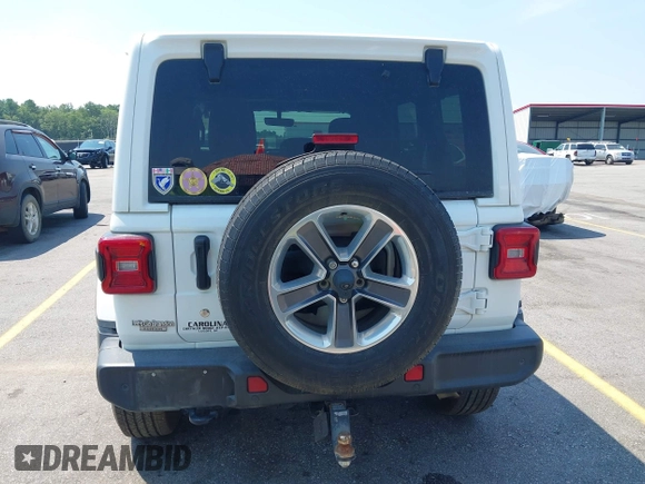 2018 Jeep Wrangler Unlimited Sahara with VIN 1C4HJXEG6JW112976, listed as a IAAI auction lot 42559123 with 76,066 mi miles and . Bid and sale history available at DreamBid. Image 16.