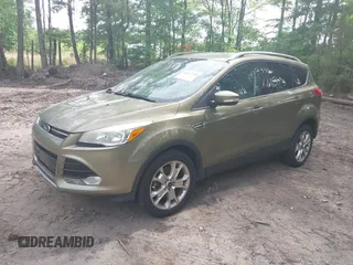 2014 Ford Escape Titanium with VIN 1FMCU9JX9EUB23972, listed as a IAAI auction lot 42217298 with 164,556 mi miles and . Bid and sale history available at DreamBid. Image 2.