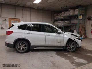 2016 BMW X1 xDrive28i with VIN WBXHT3C30G5E52065, listed as a IAAI auction lot 41552781 with 205,961 mi miles. Bid and sale history available at carsss.com. Image 12.