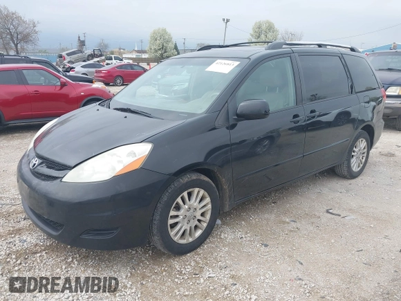 2009 Toyota Sienna XLE with VIN 5TDZK22C09S225520, listed as a IAAI auction lot 42126813 with 217,573 mi miles. Bid and sale history available at carsss.com. Image 2.