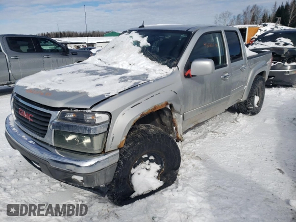 2011 GMC Canyon SLT with VIN 1GTH6NFE2B8117617, listed as a Copart auction lot 43222695 with 146,277 mi miles and Salvage Title. Bid and sale history available at carsss.com. Image 1.