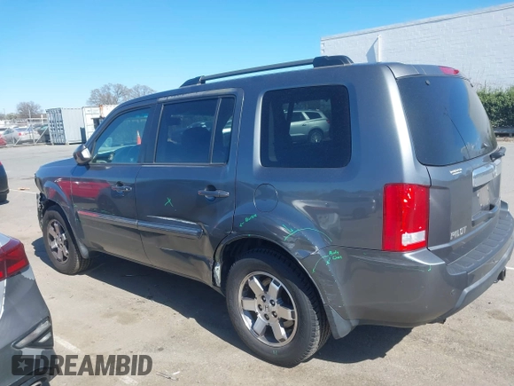 2010 Honda Pilot Touring with VIN 5FNYF4H94AB031167, listed as a IAAI auction lot 41800738 with 184,126 mi miles and . Bid and sale history available at carsss.com. Image 14.