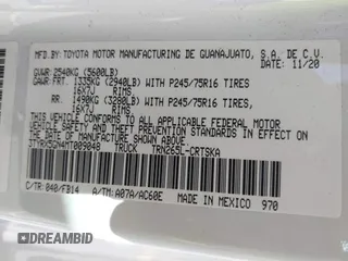 2021 Toyota Tacoma SR with VIN 3TYRX5GN4MT009048, listed as a IAAI auction lot 42291313 with 26,197 mi miles and . Bid and sale history available at DreamBid. Image 9.