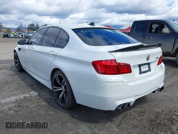 2013 BMW M5 with VIN WBSFV9C56DC772961, listed as a IAAI auction lot 41765457 with 104,568 mi miles. Bid and sale history available at carsss.com. Image 3.