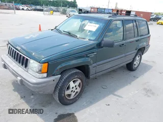 1995 Jeep Grand Cherokee Laredo with VIN 1J4FX58S0SC716398, listed as a IAAI auction lot 42647346 with 58,184 mi miles and . Bid and sale history available at DreamBid. Image 2.